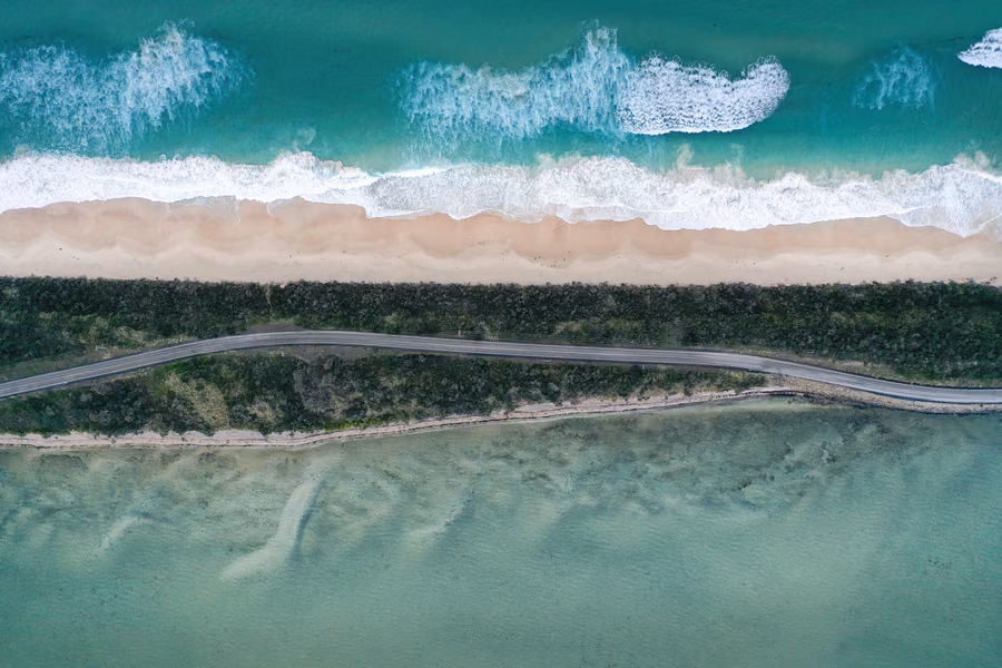 Aerial view of The Neck on Bruny Island, with beach, ocean and road