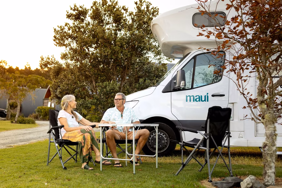 maui motorhome on a grassy powered site at Hot Water Beach TOP 10 Holiday Park