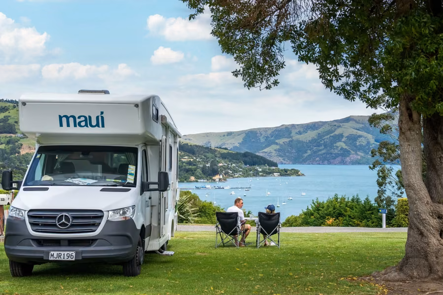 maui motorhome on a site overlooking Akaroa Harbour at Akaroa TOP 10 Holiday Park