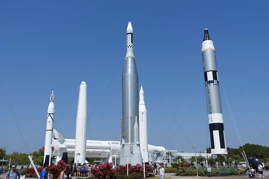 Historic rockets standing tall against a blue sky in the Rocket Garden at Kennedy Space Center Visitor Complex