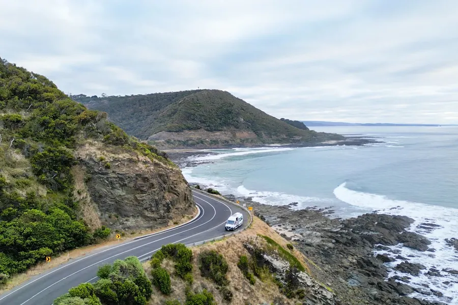 Apollo campervan driving the Great Ocean Road above the coast in Victoria