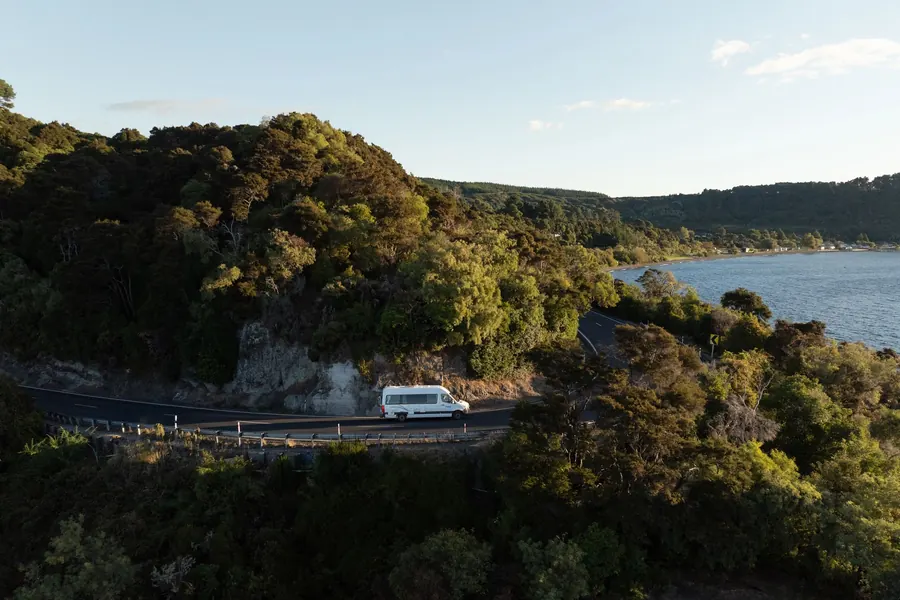 maui Ultima Plus campervan on a bush road above Lake Taupo, New Zealand