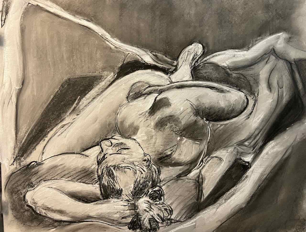 Reclining model, rendered in charcoal