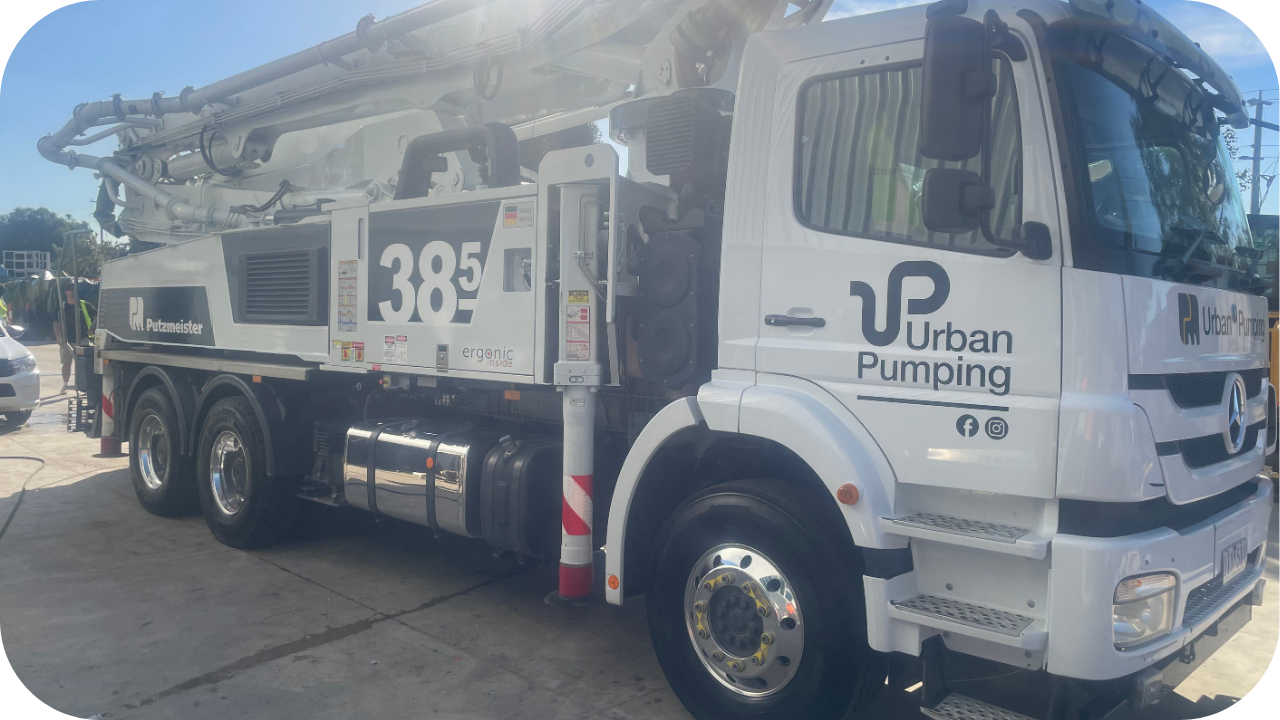 Urban Pumping concrete truck with Putzmeister boom pump parked on site, ready for high-rise concrete delivery in Melbourne.