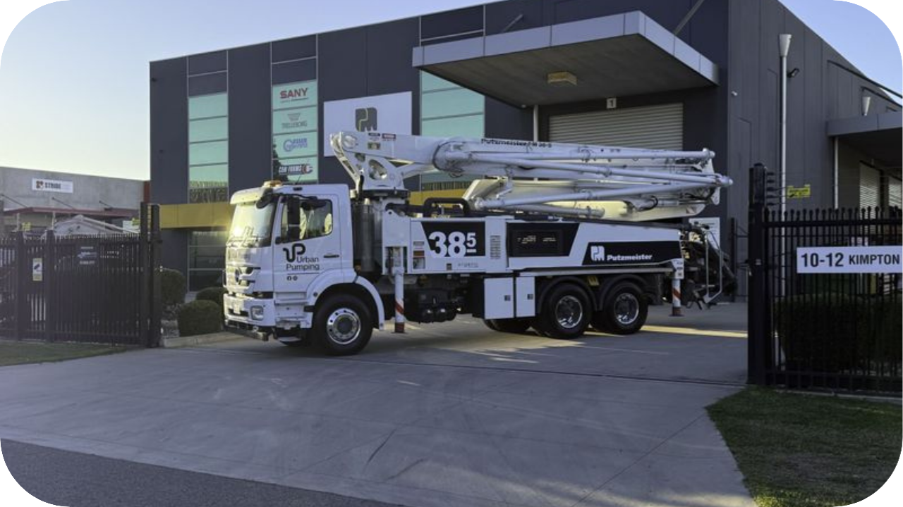 Urban Pumping boom truck parked outside company facility, ready for deployment to a Melbourne job site.