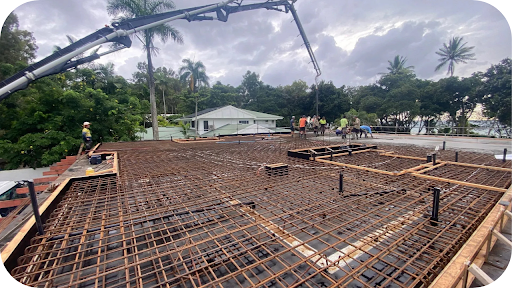 Concrete pump positioned above a reinforced slab as workers guide the pour, showing why Melbourne builders rely on pumping for faster, cleaner results