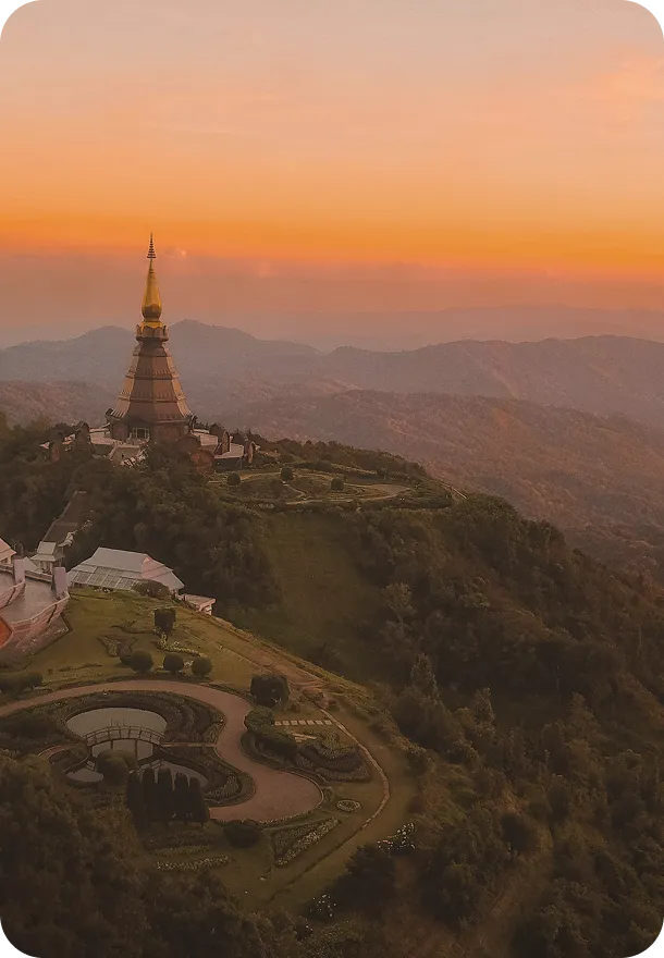 An aerial view of a large building on a hill.