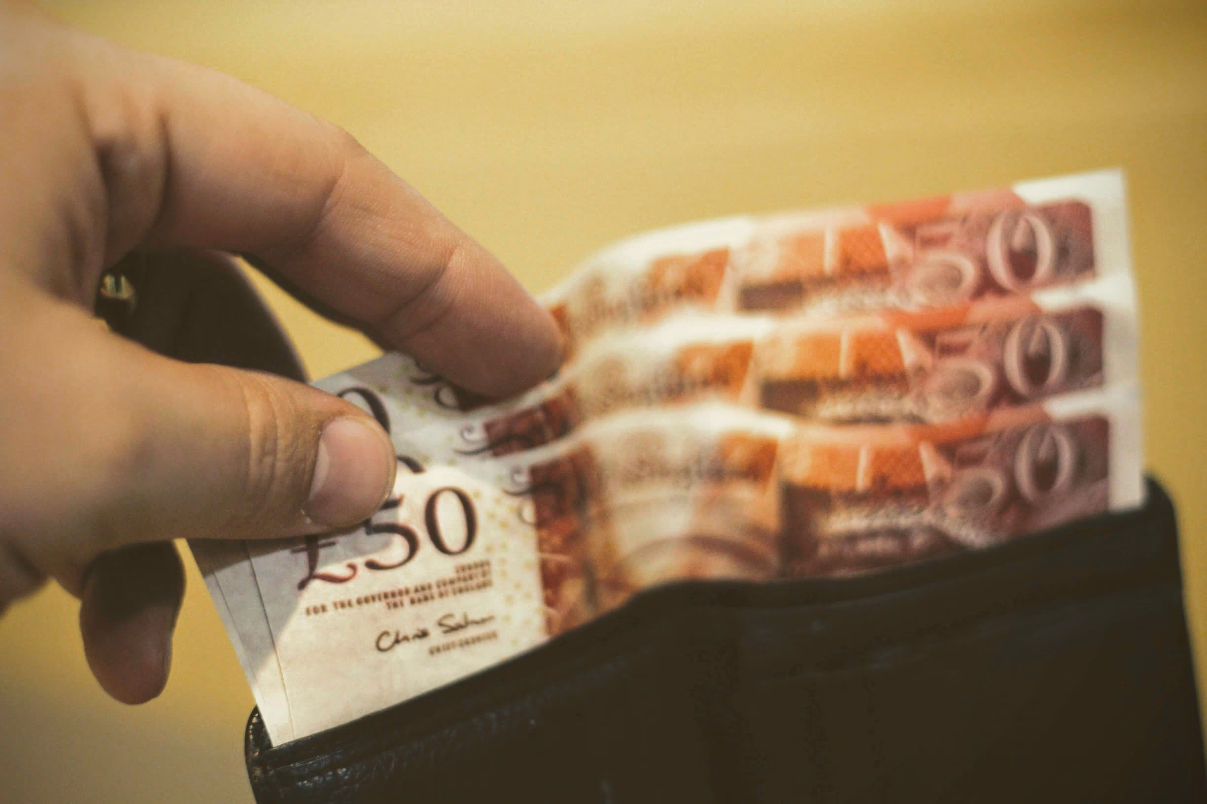 Image of someone showing pounds currency