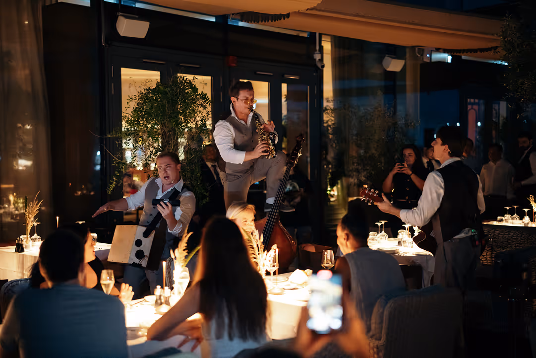 A group of people sitting around a table.