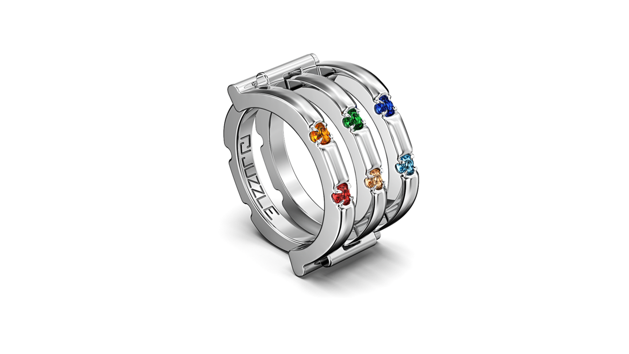 Juzzle silver ring placed on a branded blue jewelry box, side perspective.