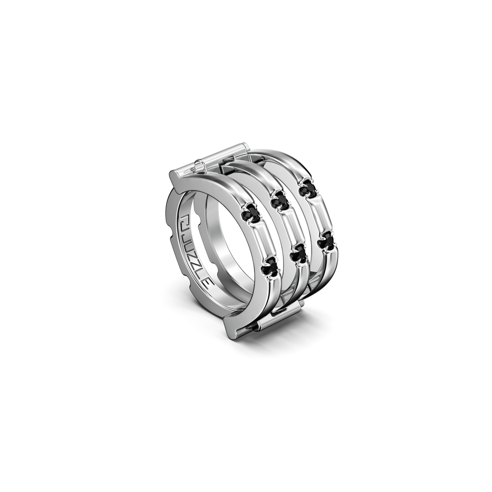 Tall modular Juzzle ring with interlocking silver sections on white backdrop.