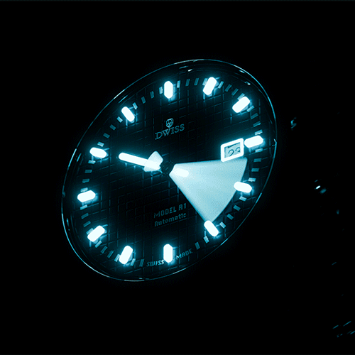 Luminous dial of DWISS A1 glowing in the dark.