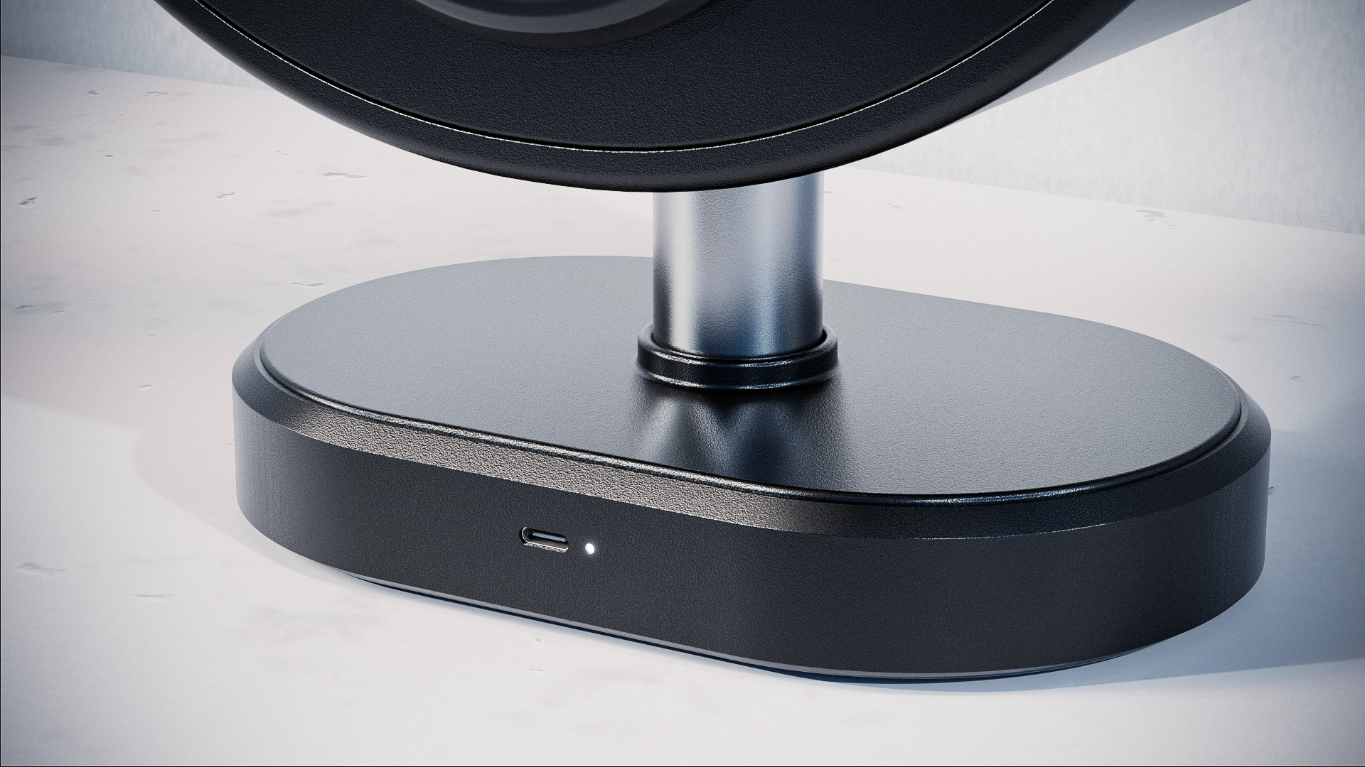 A CGI render showing the base of the speaker from a low angle, emphasizing the clean lines.