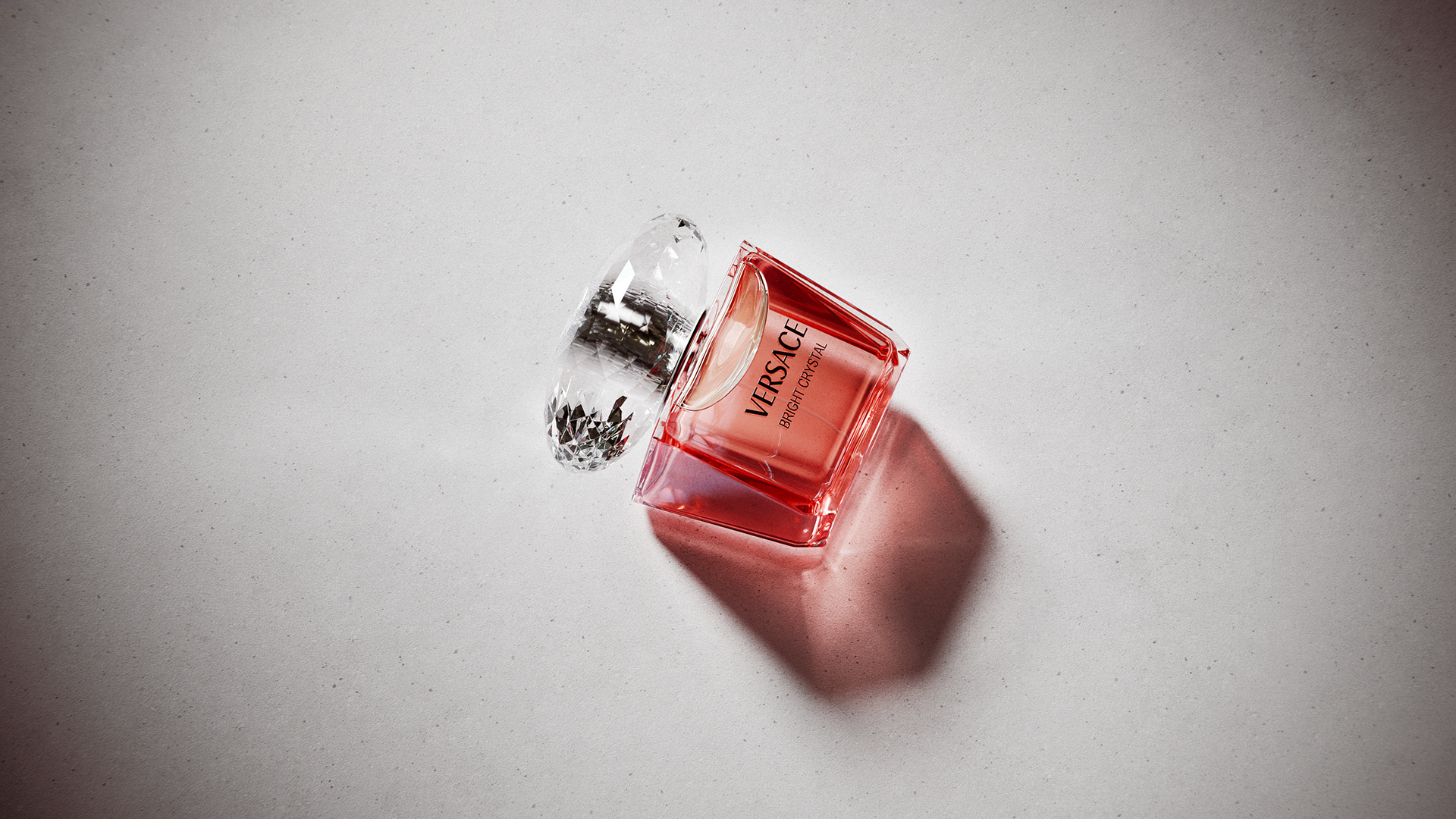 A side-angle 3D render of the Versace Bright Crystal bottle, highlighting the subtle curve of the glass and liquid inside.