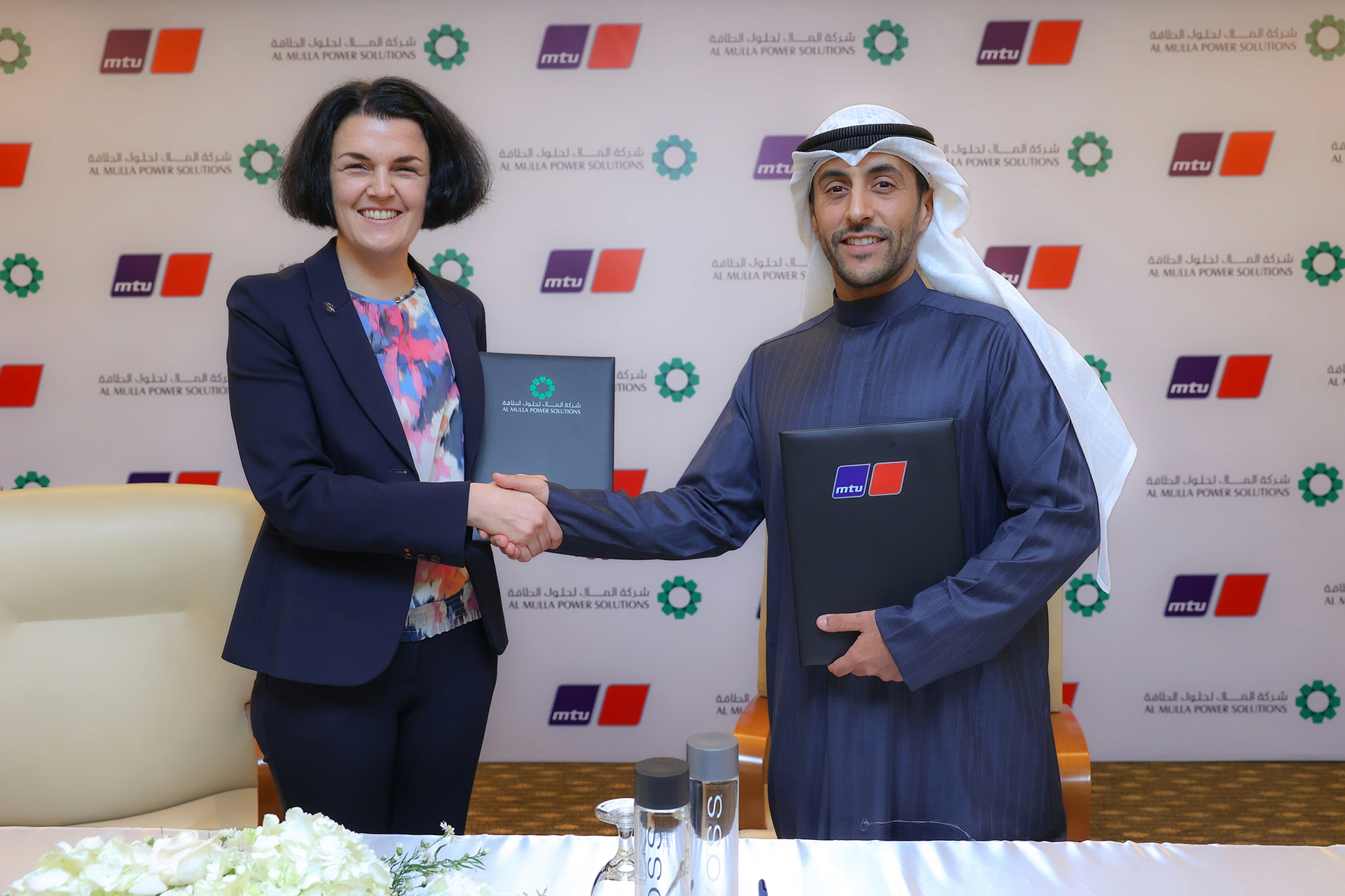 A photo of the partnership being made between Al Mulla and MTU Rolls Royce