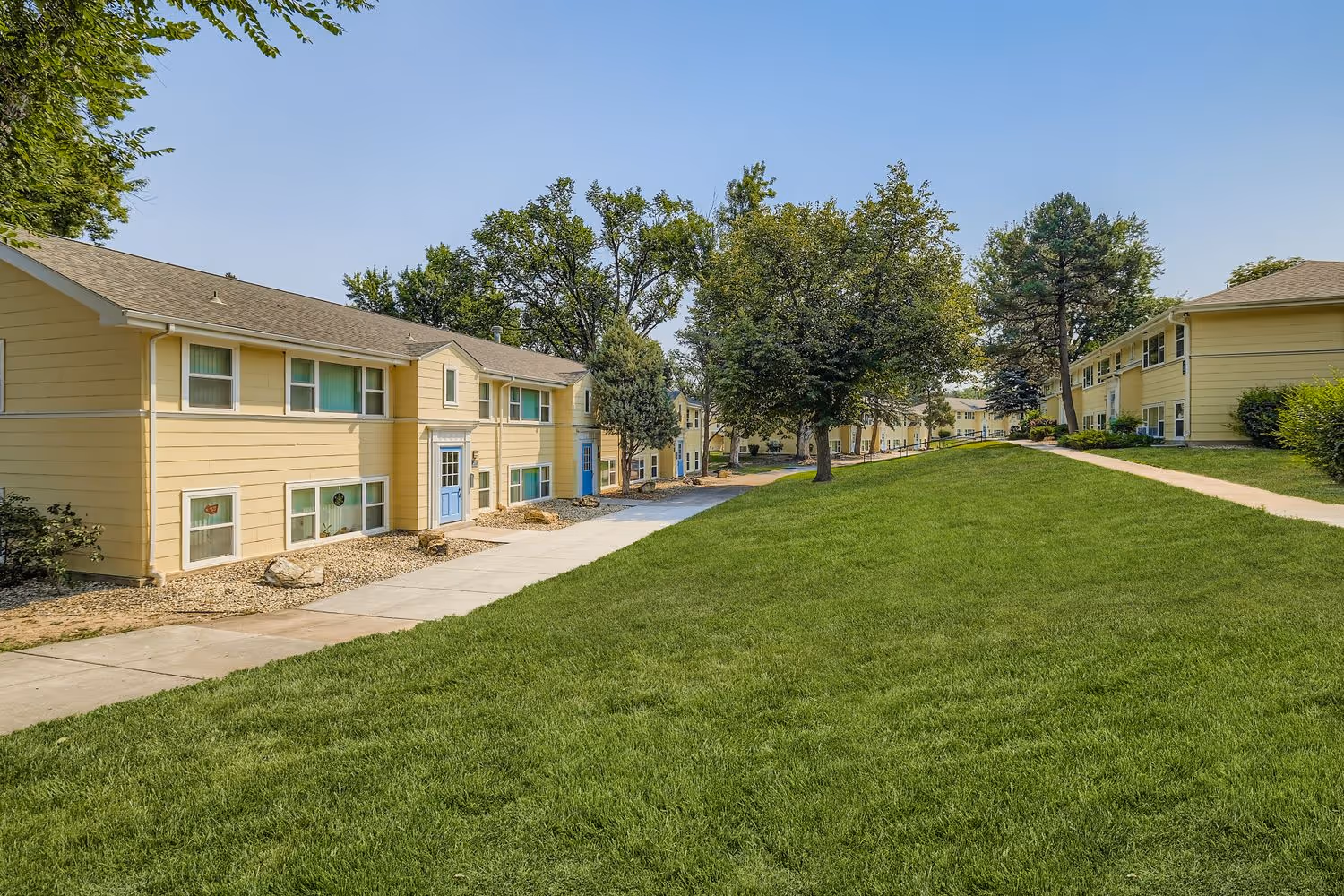 exterior of apartments with stairs to door 