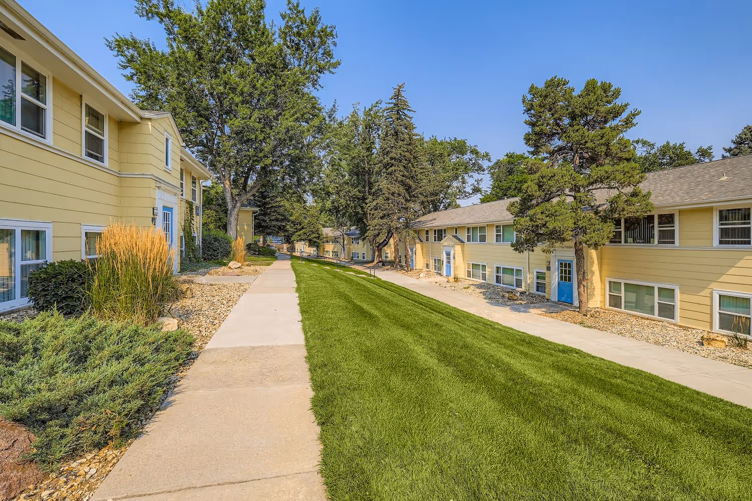 exterior of apartments with stairs to door 