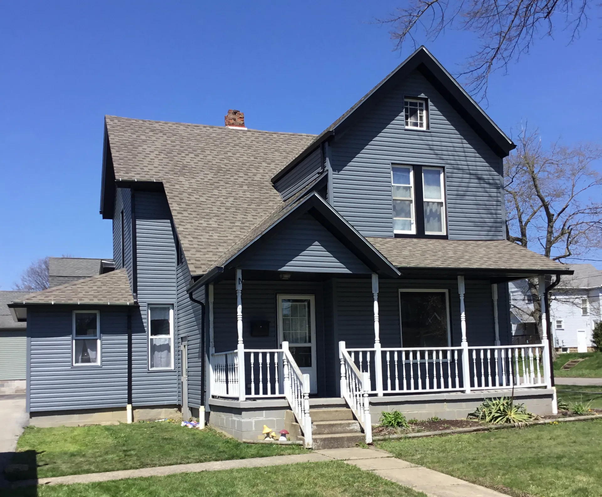 blue-grey house with vinyl siding
