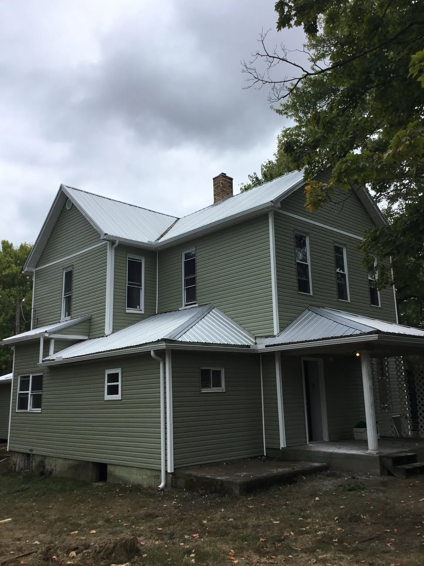 green house with vinyl siding