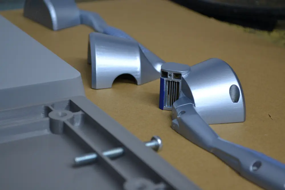 Painted prototype parts and fixings on the Nexform workbench