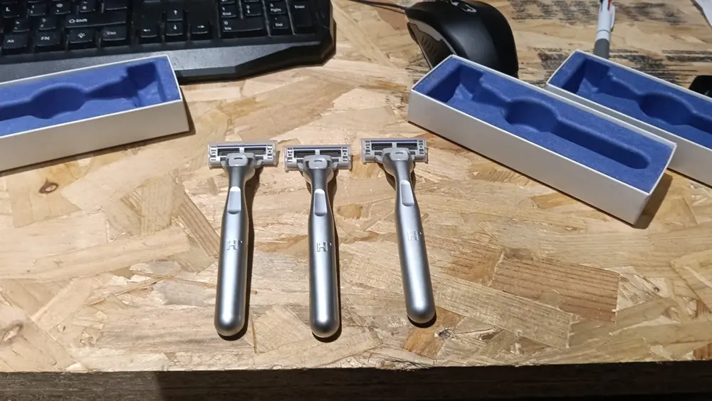 Three finished razor handle prototypes designed and built by Nexform