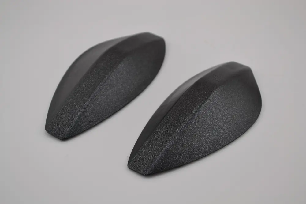 Pair of 3D printed replacement covers reverse engineered from an original part