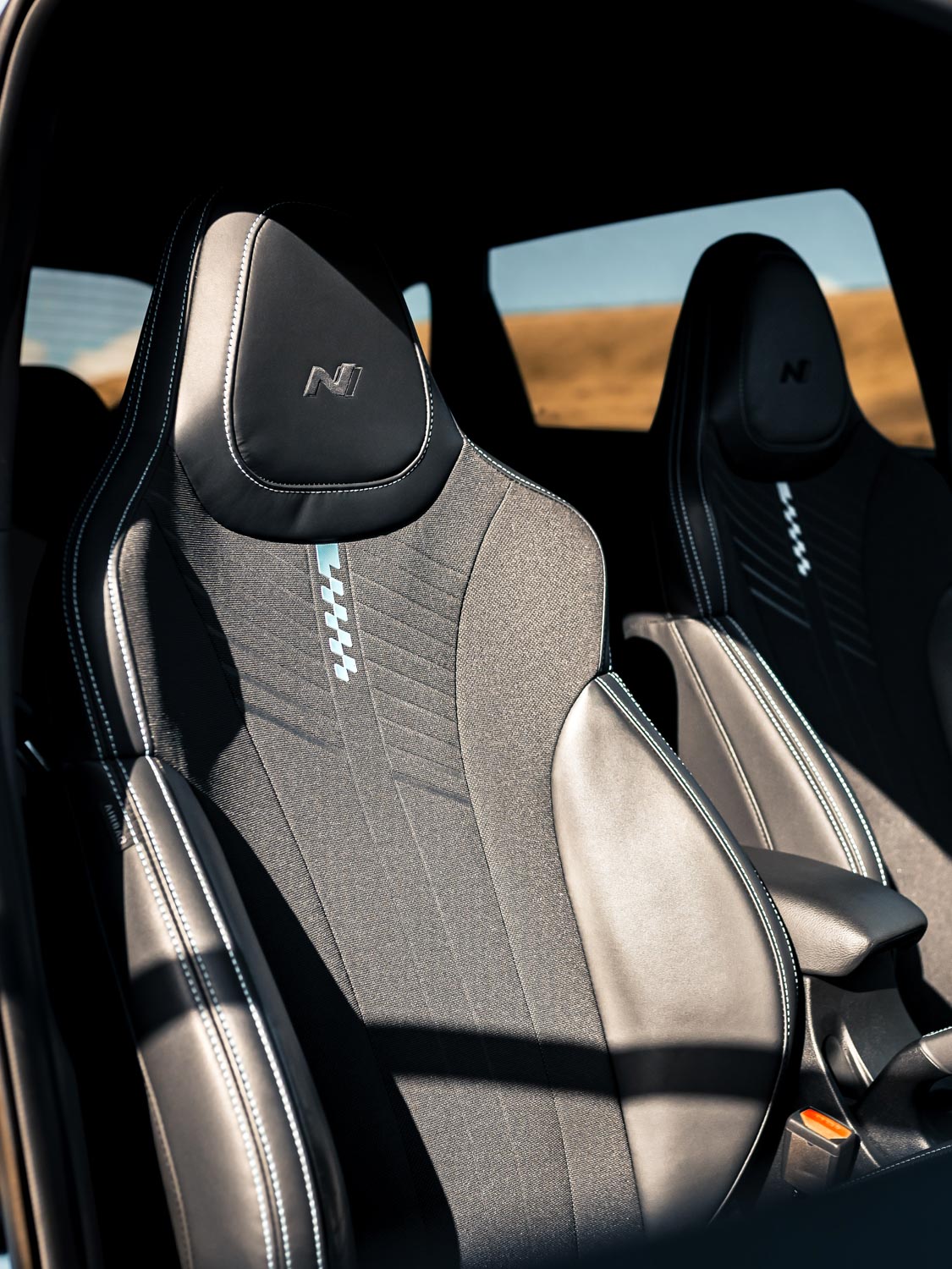Hyundai i20N Performance Blue Rush Magazine review - drivers seat shot showing half leather half cloth bucket seat