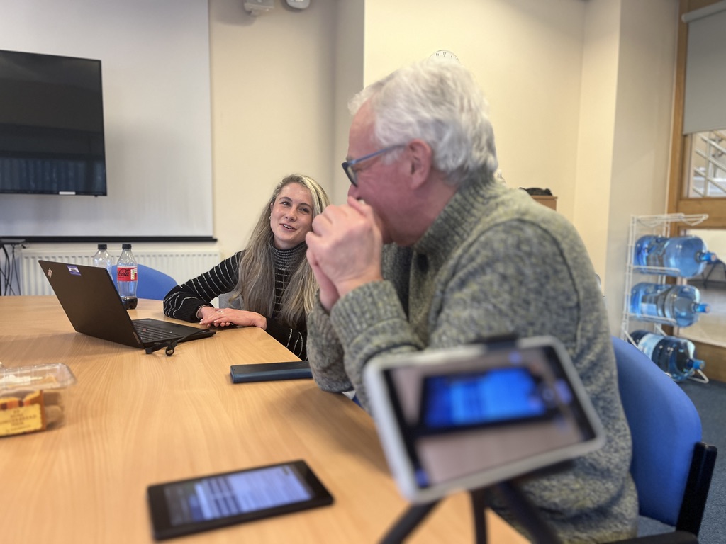 Photo of Yvee facilitating usability testing with a test participant