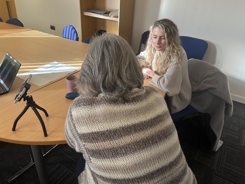 Photo of Yvee facilitating usability testing with a test participant