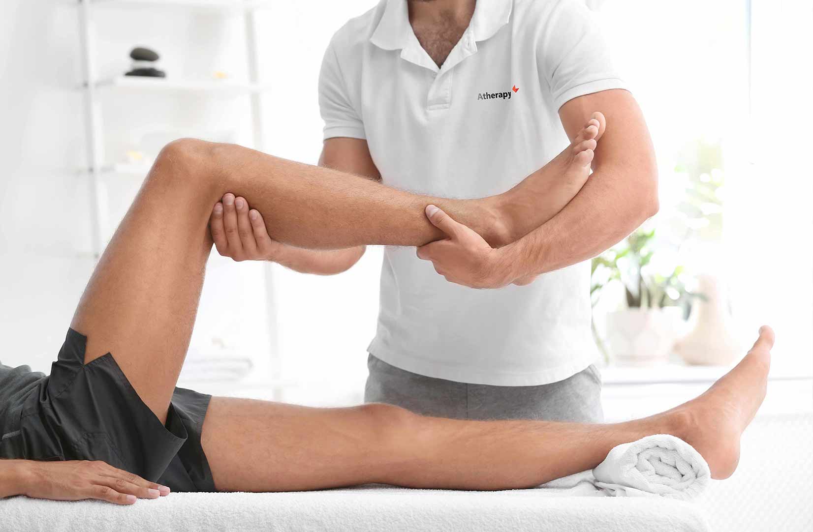 a close up of man getting treatment from a physio