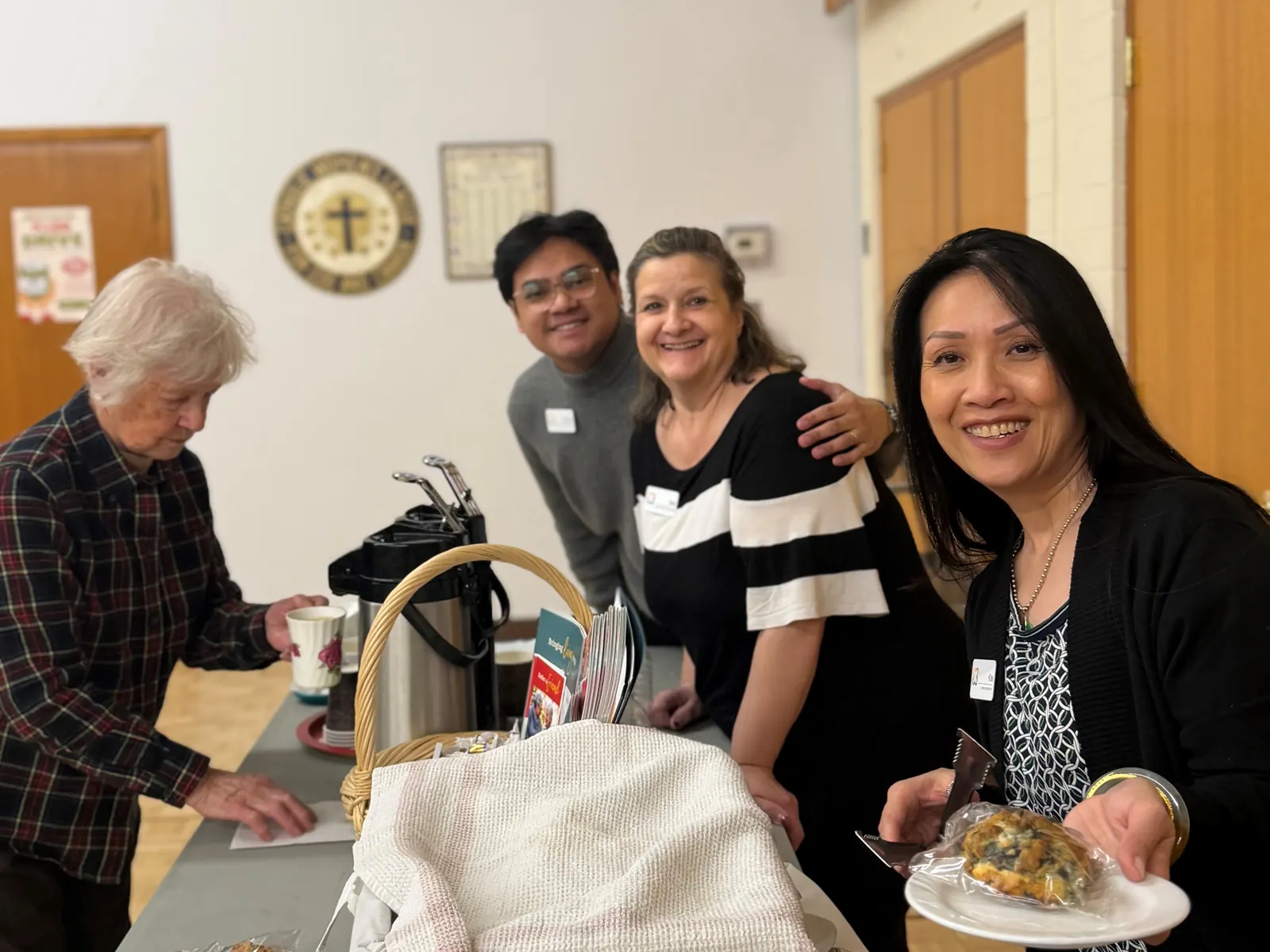 Trinity Lodge team members serve soup and baking at the Soup for Lent lunch at St. Gerard's Church