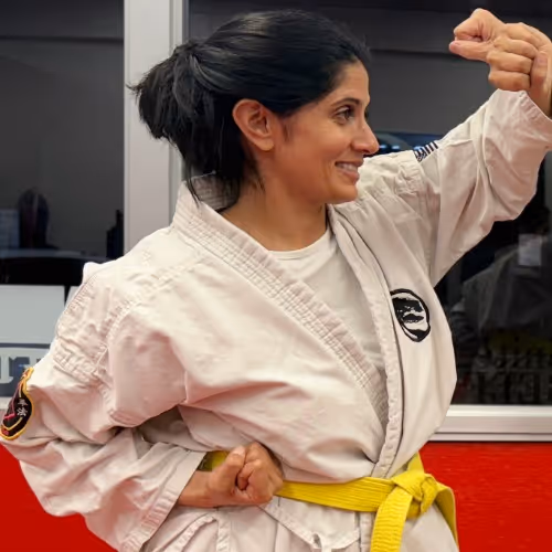 Adult Karate students training in the dojo.