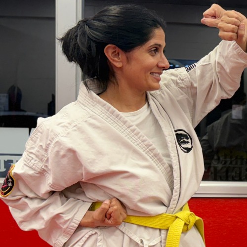 Adult Karate students training in the dojo.