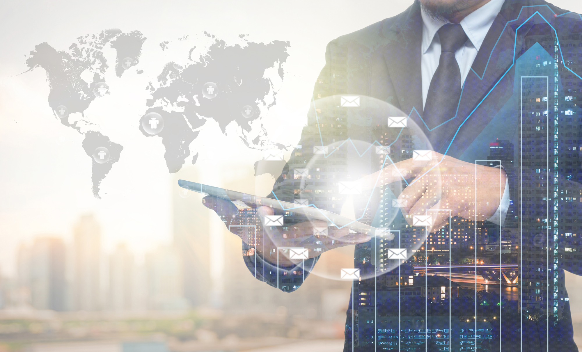 A man in a suit is holding a tablet.