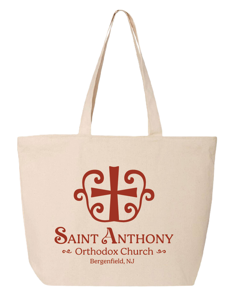 Beige tote bag with a stylized red cross and decorative swirls above red text that reads 'Saint Anthony Orthodox Church Bergenfield, NJ.'