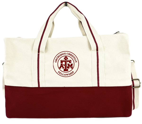 Canvas duffel bag with cream upper and maroon bottom, featuring maroon stripe along the handles and maroon logo reading 'Orthodox Christian Fellowship' with a cross and the letters A and M entwined on the front.