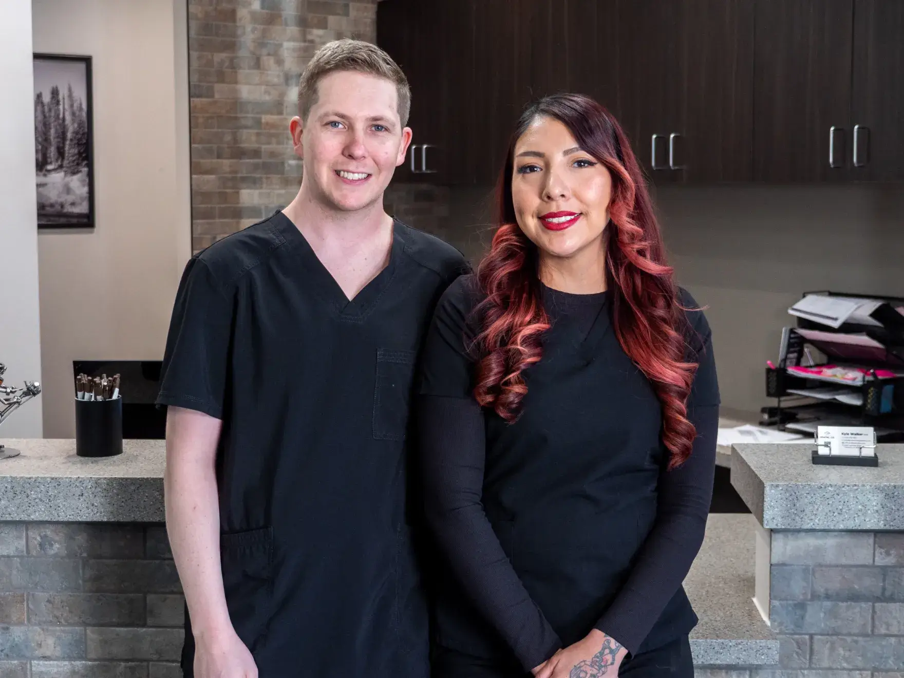 A dentist's chair and dental tools in a clean, organized treatment room.