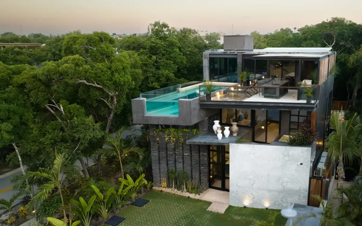 Contemporary villa with pool set in jungle canopy in Aldea Zama, Tulum