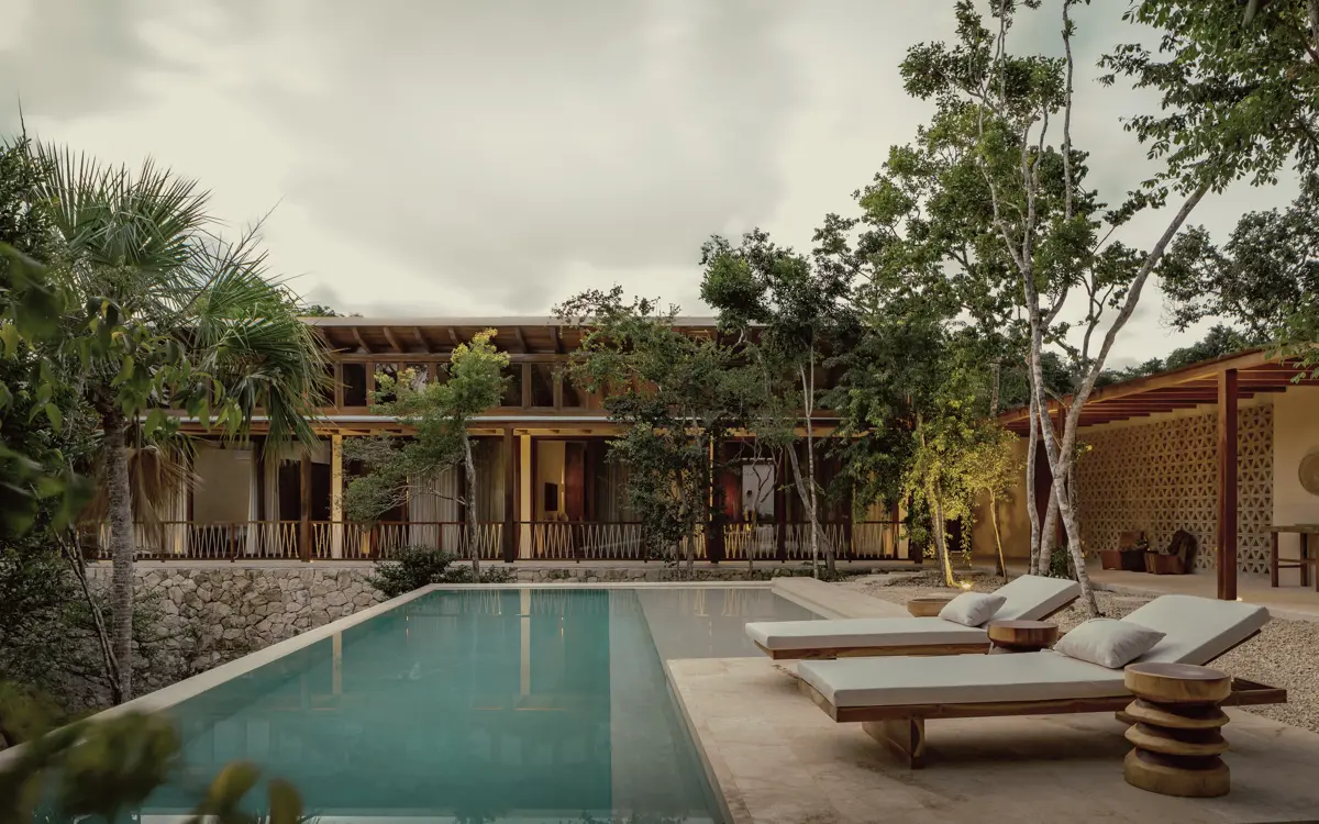 Pool and terrace backing onto jungle in Region 8, Tulum