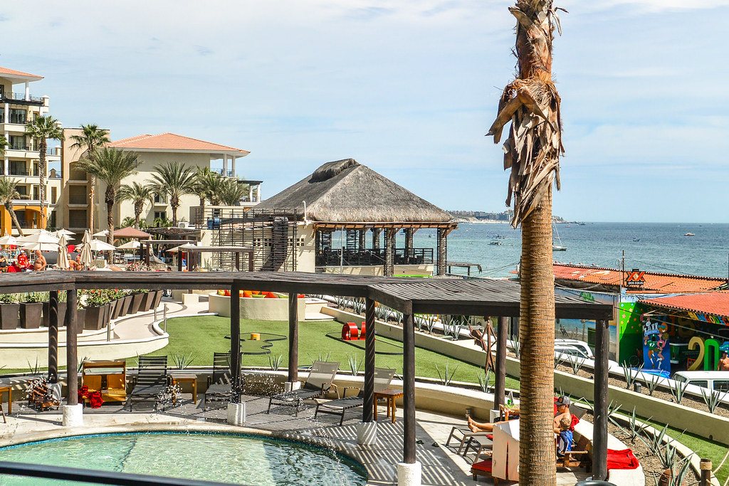 A resort pool terrace looking out to the sea at Cabo San Lucas