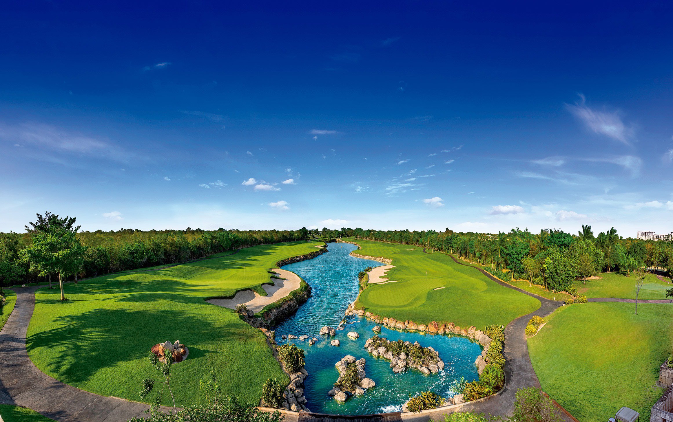 Aerial view of the El Jaguar golf course and cenote at Yucatán Country Club, Mérida