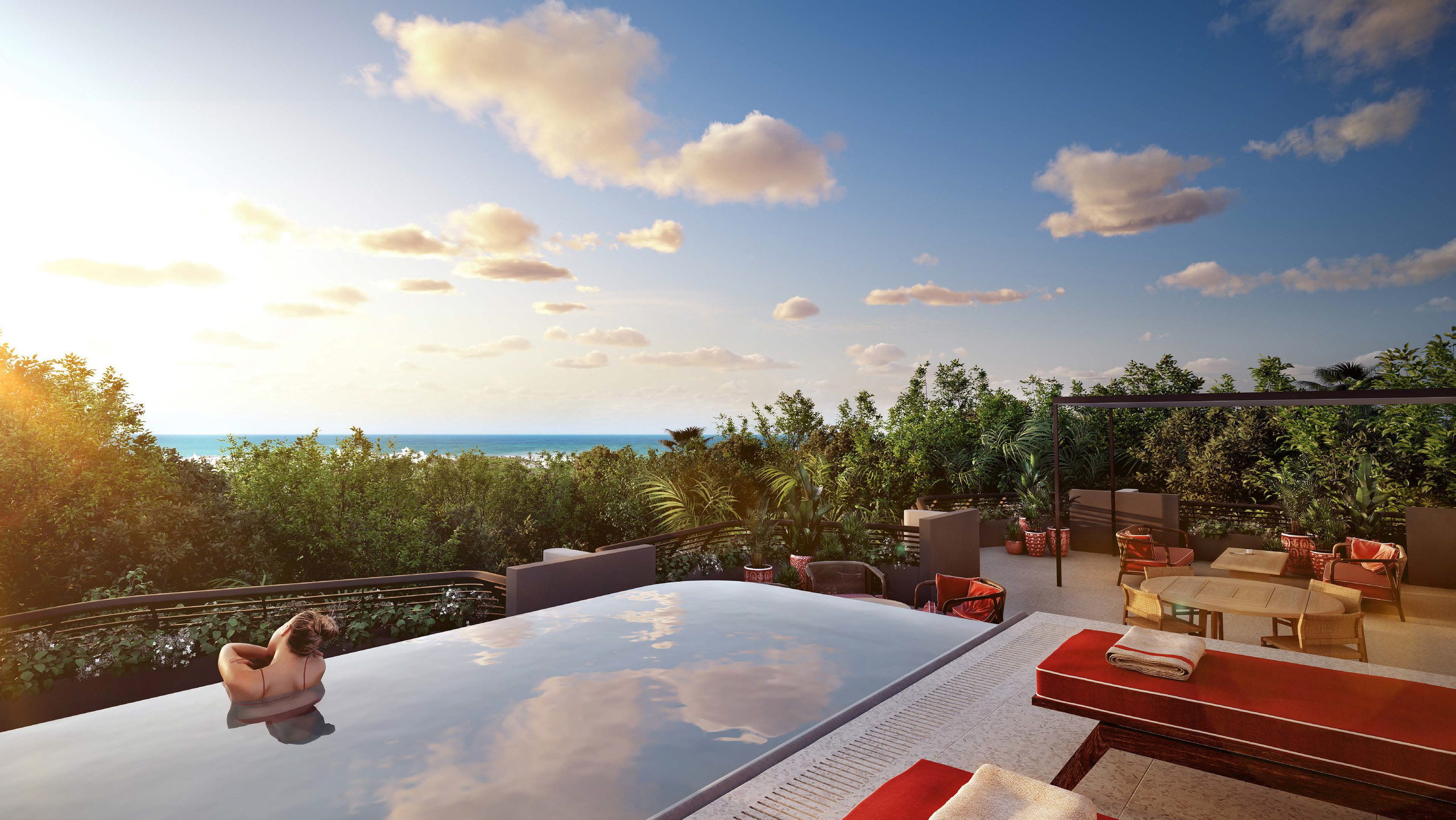 Private rooftop pool at sunset above the jungle canopy, Faena District Tulum