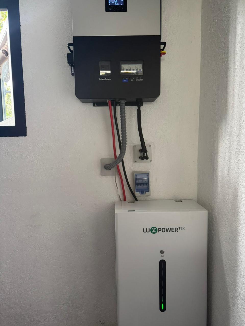 Hybrid inverter and lithium wall battery with grid and generator inputs