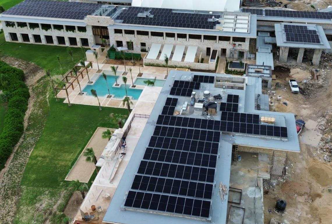 Aerial view of solar panels on a stone-clad residential club in the Riviera Maya