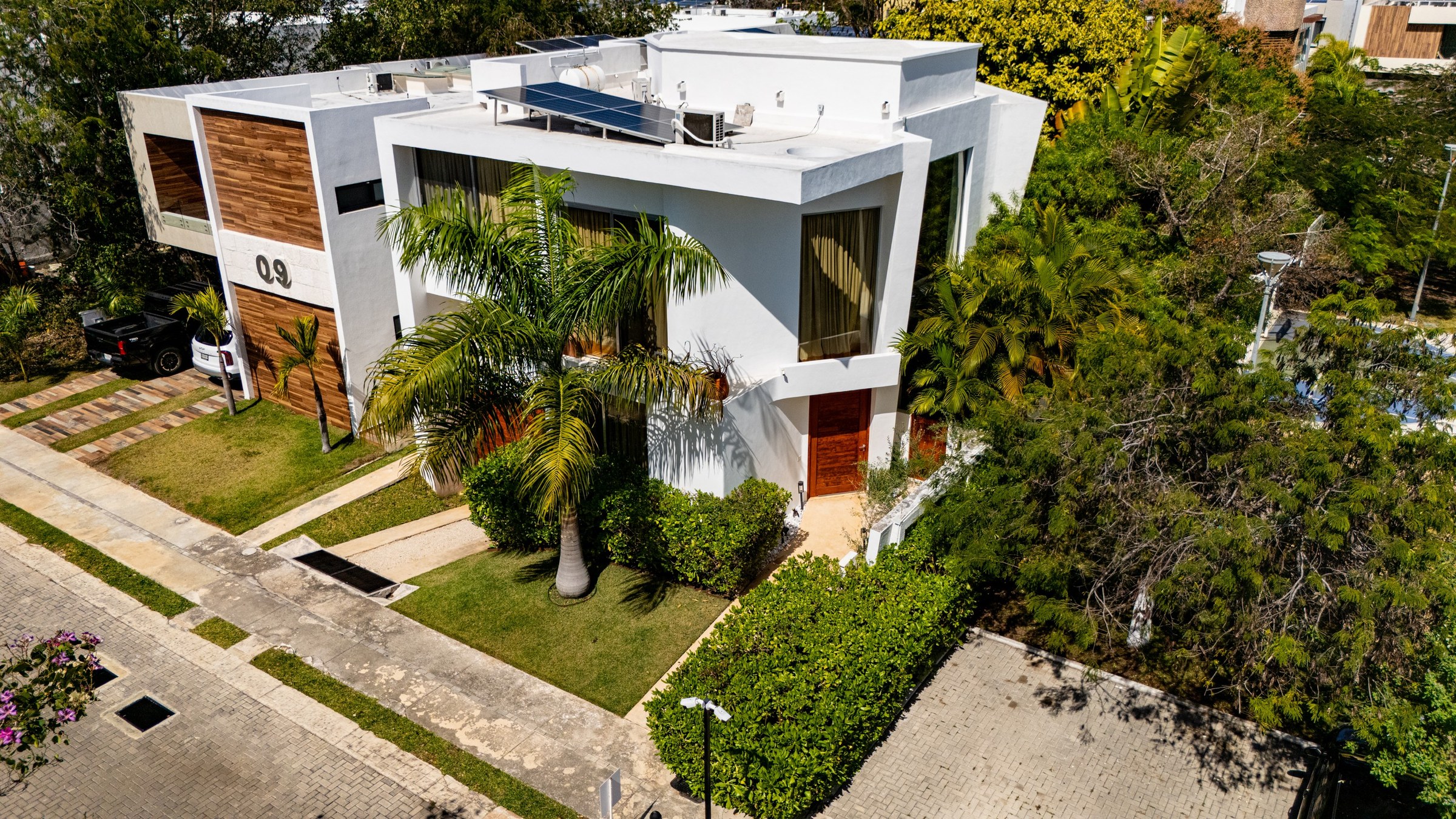 A finished four bedroom house on a paved, planted street in Playa del Carmen