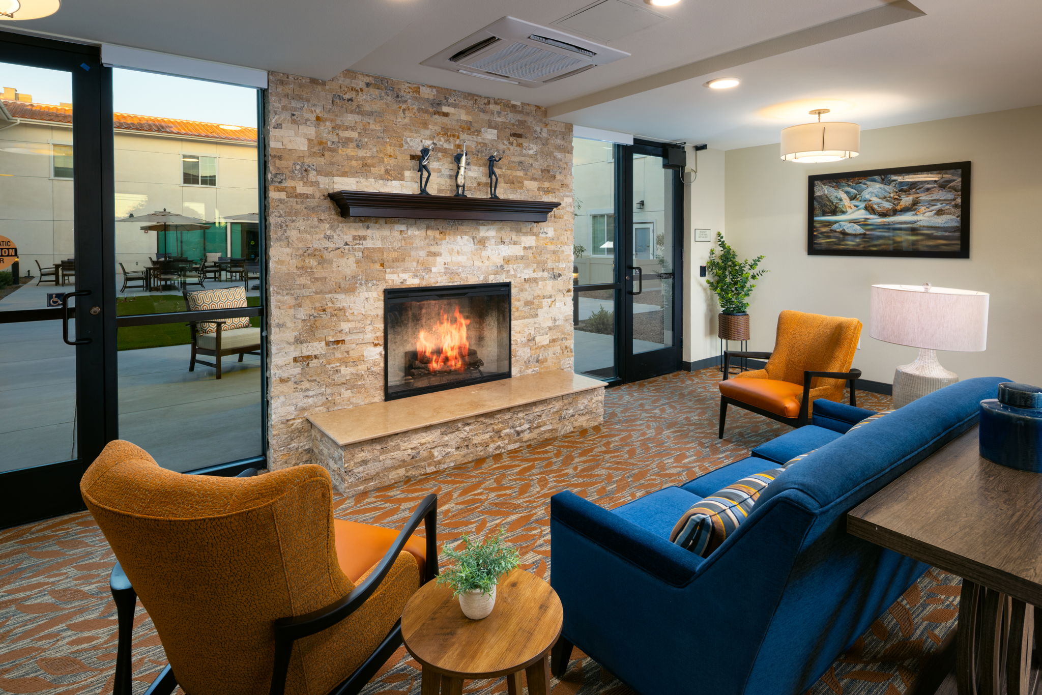 Fireplace lounge at Regency Palms Senior Living, Colton CA