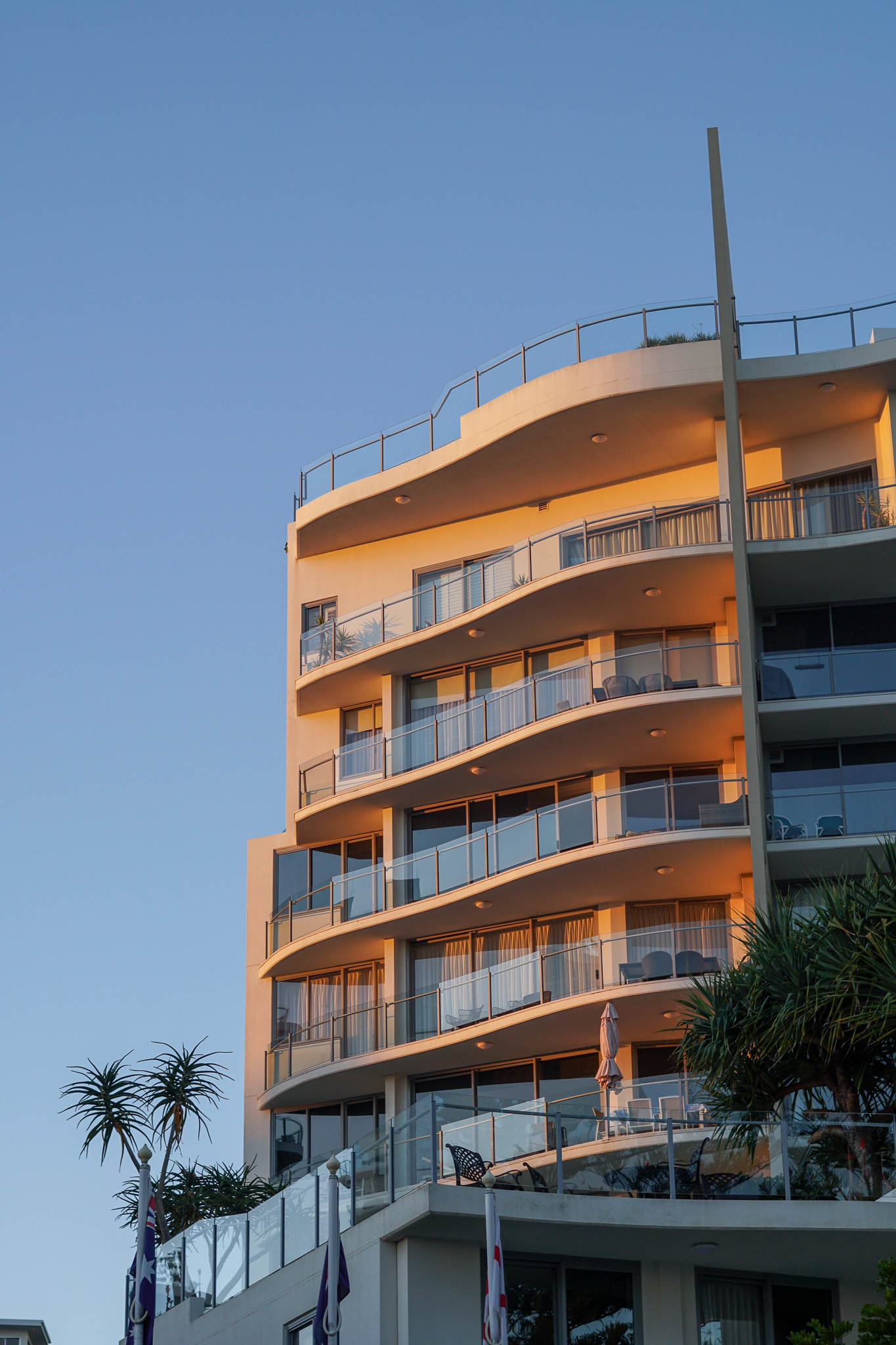 Exterior of The Garland Apartments, showcasing modern architecture and ocean-facing balconies