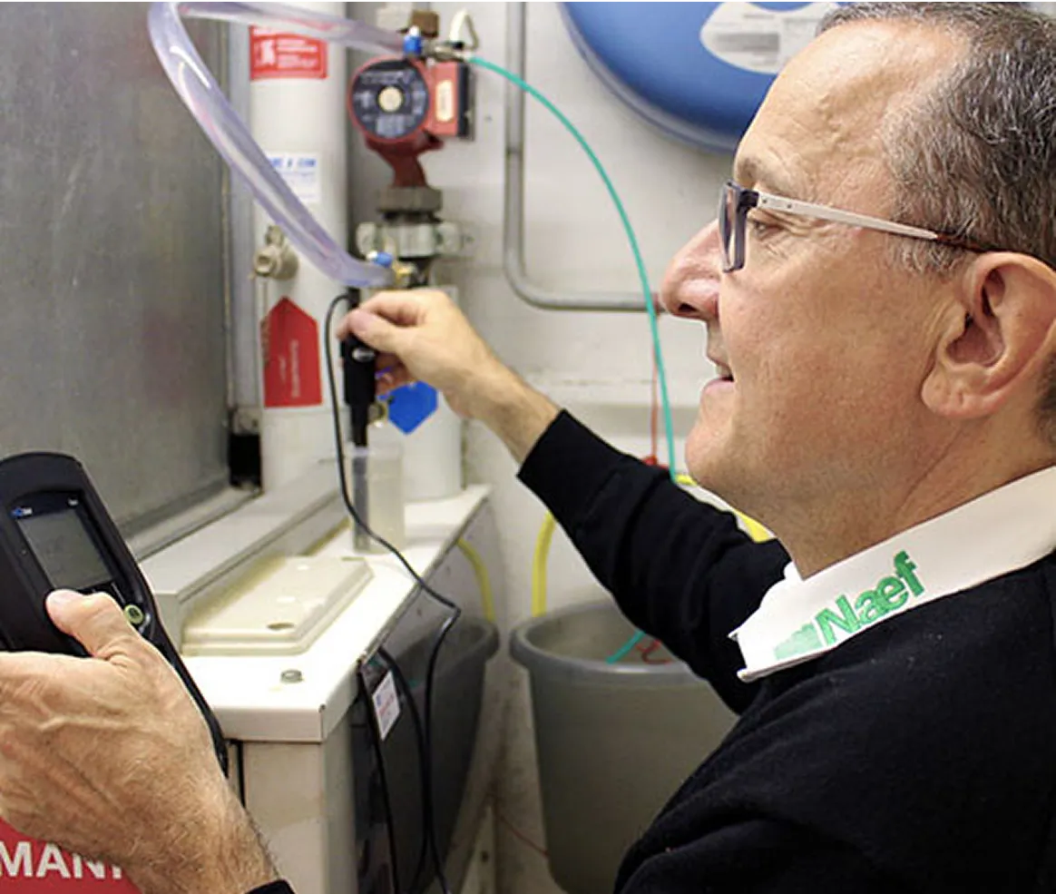 A man operating a machine in a room.
