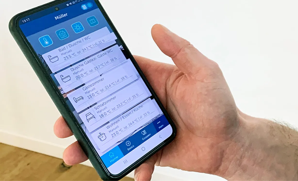 A person holding a smart phone in their hand.
