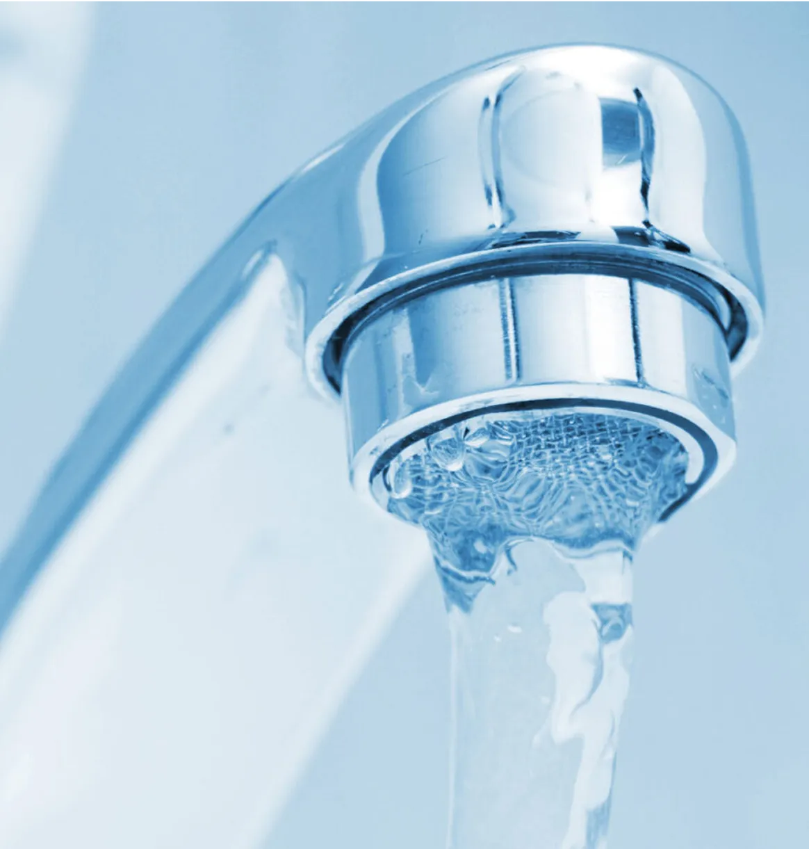 A close up of a faucet running water.